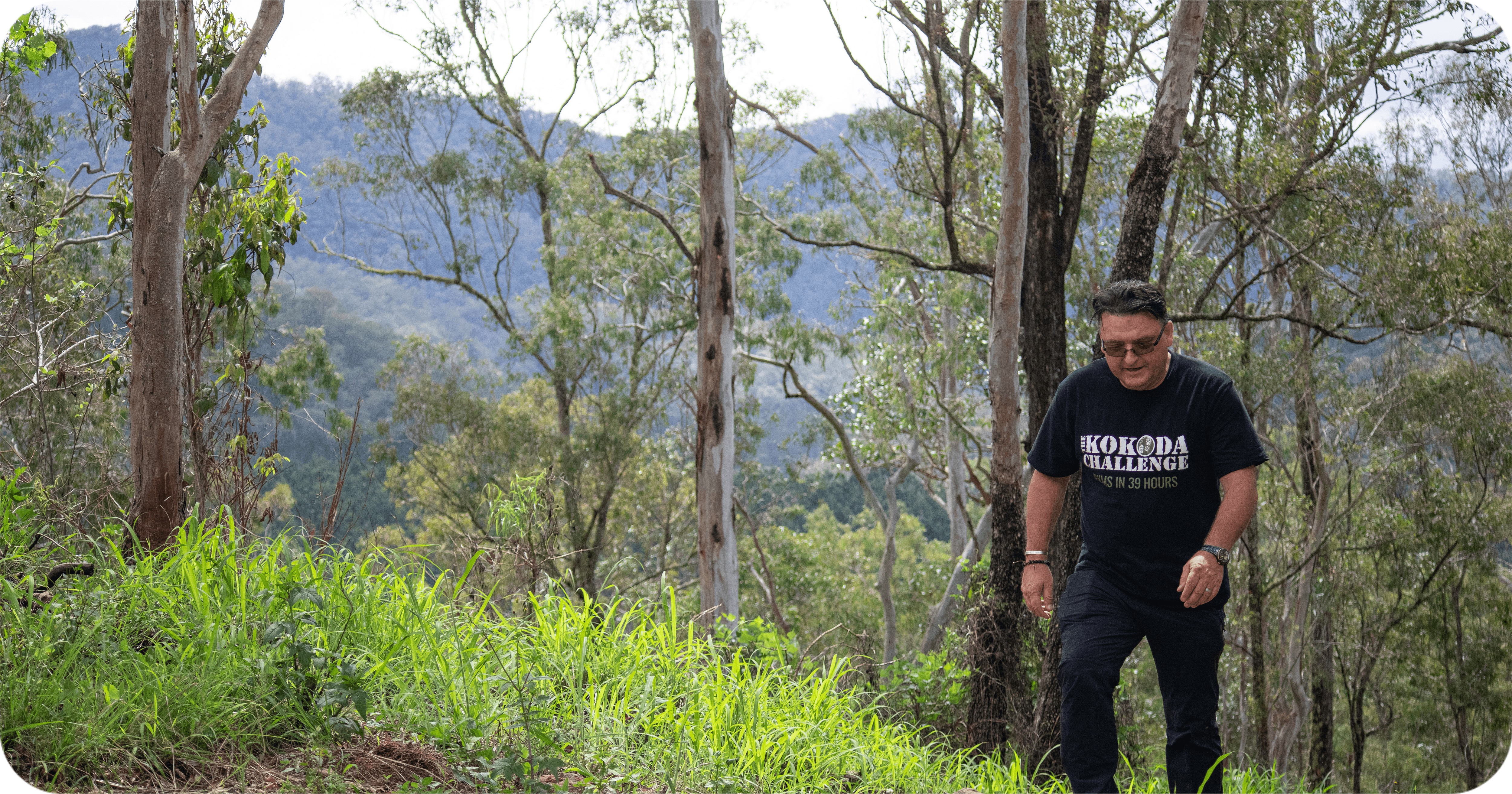 Kokoda Challenge competitor hiking through Imbil State Forest in the Sunshine Coast hinterland” Kokoda Challenge competitor hiking through Imbil State Forest in the Sunshine Coast hinterland”